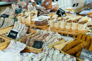 Pilgrim enjoying fresh local produce at a village market in Le Gers, France. Pilgrim enjoying fresh local produce at a village market in Le Gers, France.