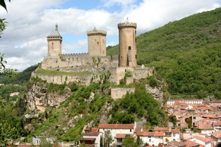 Foix Château overlooking the town with dramatic hilltop setting and surrounding Pyrenees landscape in Ariège Foix Château overlooking the town with dramatic hilltop setting and surrounding Pyrenees landscape in Ariège