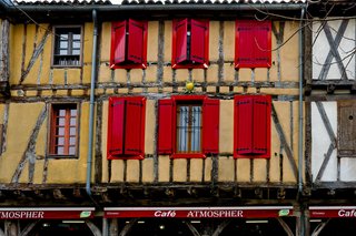 Historic market square in Mirepoix with arcaded buildings and open space in a charming medieval town in Ariège Historic market square in Mirepoix with arcaded buildings and open space in a charming medieval town in Ariège