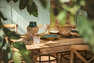 Al fresco dining on a sun-drenched terrace overlooking the rolling countryside of Le Gers, showcasing the relaxed lifestyle of Occitanie. Al fresco dining on a sun-drenched terrace overlooking the rolling countryside of Le Gers, showcasing the relaxed lifestyle of Occitanie.