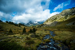 Untouched Pyrenees landscape in southern France with rolling mountains, stone cottages, and remote village scenery