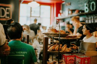 Customers waiting outside a French boulangerie to buy fresh bread