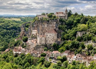 Scenic village and countryside in Occitanie, France, showcasing the attractive lifestyle and affordability of living in Occitanie France. Scenic village and countryside in Occitanie, France, showcasing the attractive lifestyle and affordability of living in Occitanie France.