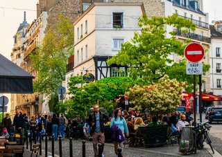 People gather in the streets to chat. People gather in the streets to chat.